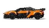 LEGO Speed Champions McLaren W1 car shown from the side with orange and black bodywork, black wheels, side air intake details, and adjustable rear wing on a white background
