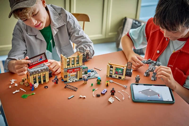 Two children building LEGO Spider-Man vs. Mysterio The Daily Bugle with the LEGO Builder app