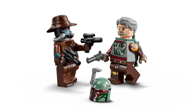 LEGO Star Wars minifigures showing Cobb Vanth holding a blaster pistol and Cad Bane wearing a brown hat and holding dual blasters, with Boba Fett’s helmet placed between them