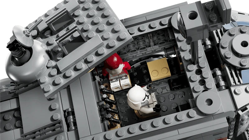 Overhead view inside the LEGO Republic Juggernaut showing two clone troopers, black seating and a rack of blasters