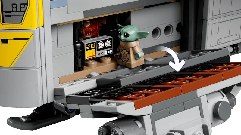 Grogu standing inside the open cargo compartment of the LEGO Razor Crest beside a control panel with the side ramp lowered