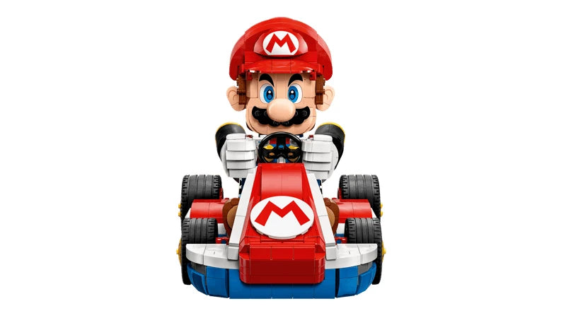 Front view of Mario gripping the steering wheel of the red, white and blue LEGO Standard Kart