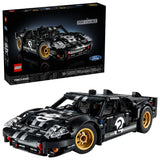LEGO Technic 1966 Ford GT40 MKII race car model displayed beside the product box, featuring black bodywork, silver racing stripes, and gold wheels