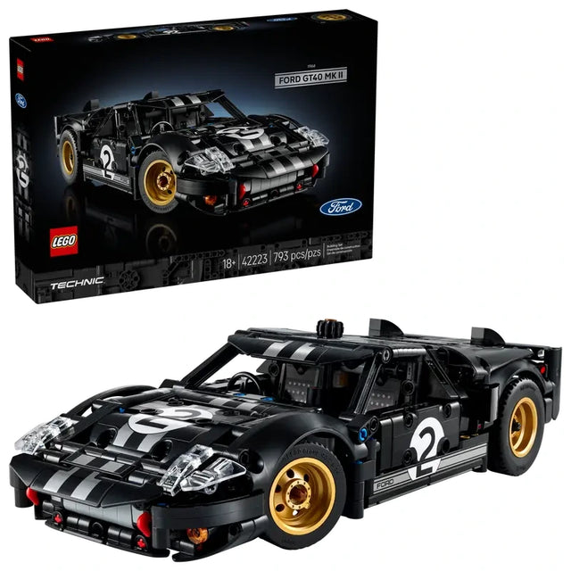 LEGO Technic 1966 Ford GT40 MKII race car model displayed beside the product box, featuring black bodywork, silver racing stripes, and gold wheels