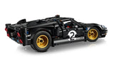 Side view of the LEGO Technic 1966 Ford GT40 MKII race car showing black and silver livery, number 2 door marking, and gold wheels