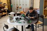 Person building LEGO Technic Aston Martin Aramco AMR25 F1 Car