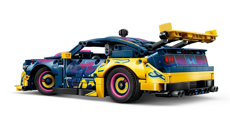 Rear three quarter view of the LEGO Technic Custom Garage Ford Mustang GT Car 42236 with yellow rear bodywork and spoiler