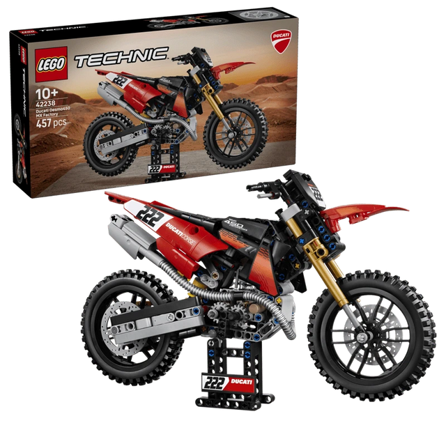 LEGO Technic Ducati Desmo450 MX Factory Motorcycle 42238 box beside the completed motorcycle model 