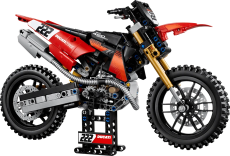 Completed LEGO Technic Ducati Desmo450 MX Factory Motorcycle 42238 model displayed on its stand