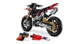 LEGO Technic Ducati Desmo450 MX Factory Motorcycle 42238 with the seat and red body panels removed and placed in front