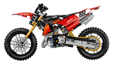 Side profile of the LEGO Technic Ducati Desmo450 MX Factory Motorcycle 42238 showing the red bodywork, chain and knobbly tyres