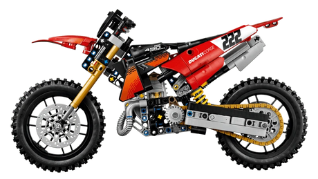 Side profile of the LEGO Technic Ducati Desmo450 MX Factory Motorcycle 42238 showing the red bodywork, chain and knobbly tyres