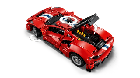 LEGO Technic Ferrari 488 Pista Car 42235 viewed from above with raised body panels and arrows showing wheel movement and the top control