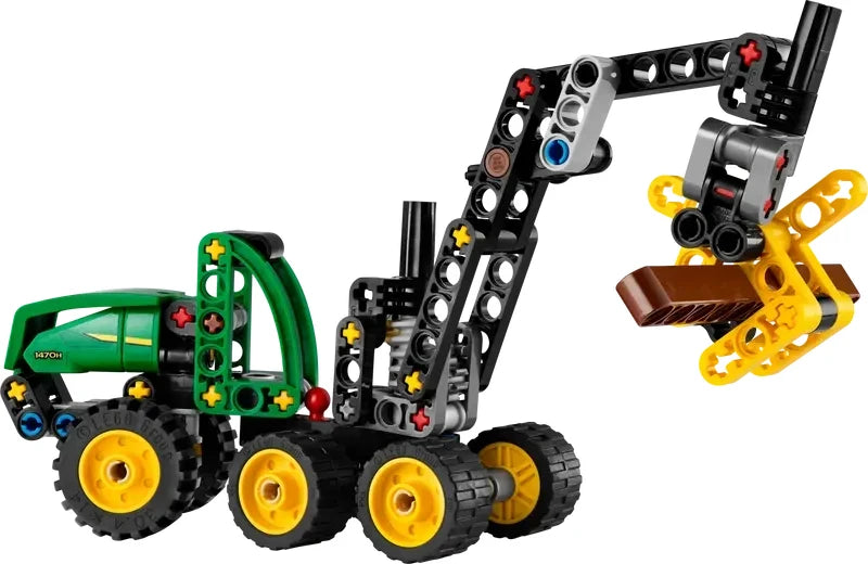Assembled LEGO Technic John Deere 1470H Wheeled Harvester model using its claw to grip and lift a brown log piece.