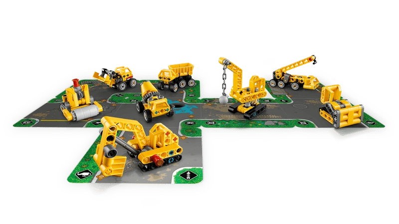 LEGO Technic Mighty Machines 42233 construction vehicles arranged across connected road cards