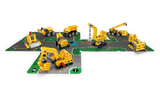 LEGO Technic Mighty Machines 42233 construction vehicles arranged across connected road cards