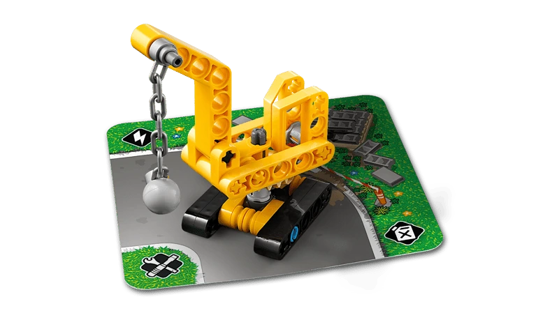 LEGO Technic Mighty Machines 42233 wrecking ball crane build displayed on a road card