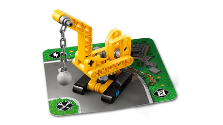 LEGO Technic Mighty Machines 42233 wrecking ball crane build displayed on a road card
