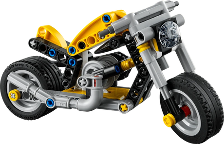 Side view of built LEGO Technic Yellow Motorcycle 42225 showing yellow body panels, black wheels, chain drive and 3 piston engine