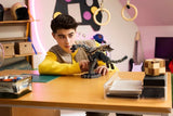 Child adjusting a LEGO Minecraft Ender Dragon build on a desk