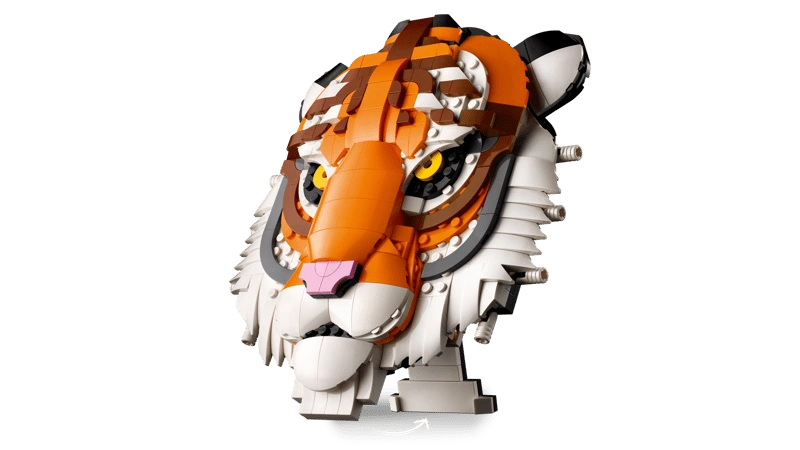 LEGO tiger head model shown at an angle on a small display stand