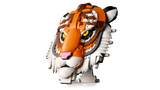 LEGO tiger head model shown at an angle on a small display stand