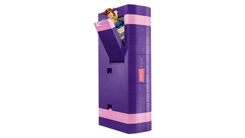 LEGO purple book build with an open front section and Woody figure visible near the top
