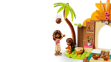 LEGO Moana and Simea figures beside a palm tree and village house section