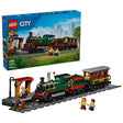 LEGO City Vintage Steam Train box beside built steam train, station platform, track and minifigures