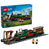 LEGO City Vintage Steam Train box beside built steam train, station platform, track and minifigures