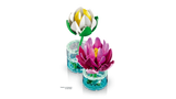 Angled view of LEGO Water Lilies with white flower behind pink flower in transparent blue bases