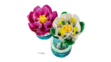 Top view of LEGO Water Lilies pink and white flower builds with yellow centres