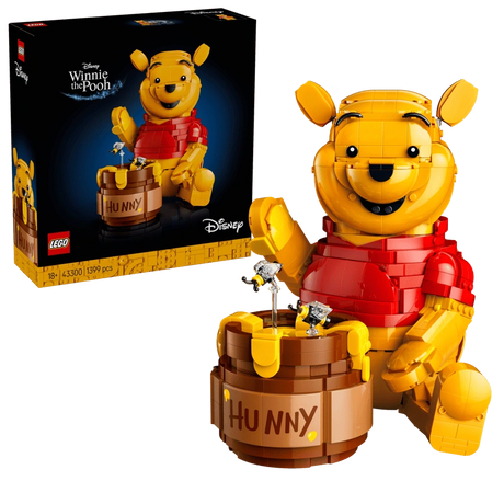 LEGO Winnie the Pooh 43300 display model with Hunny pot, bees and product box shown beside the seated Winnie the Pooh figure