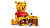 LEGO Winnie the Pooh 43300 with the Hunny pot opened to reveal 2 interior rooms, plus small Winnie the Pooh and Eeyore figures in front