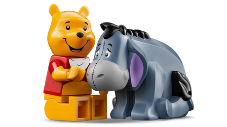 LEGO Winnie the Pooh 43300 Winnie the Pooh minifigure sitting beside Eeyore figure