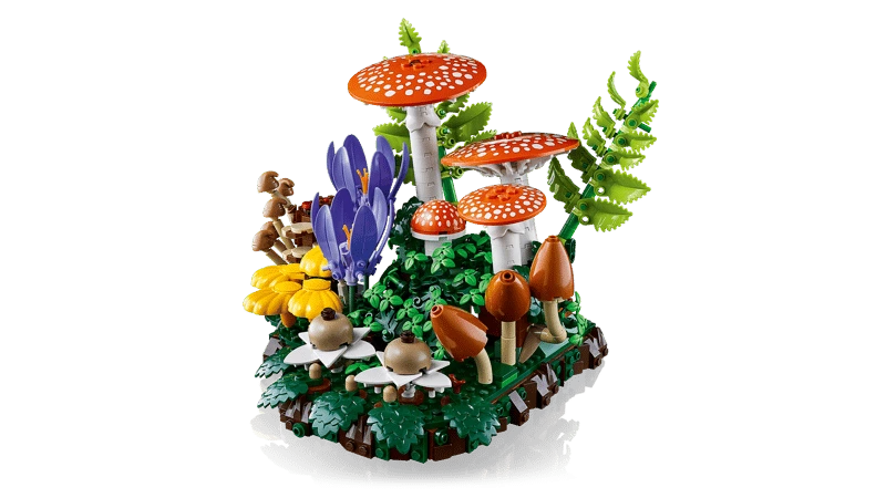 Side view of LEGO Woodland Mushrooms display with red mushrooms, flowers and foliage