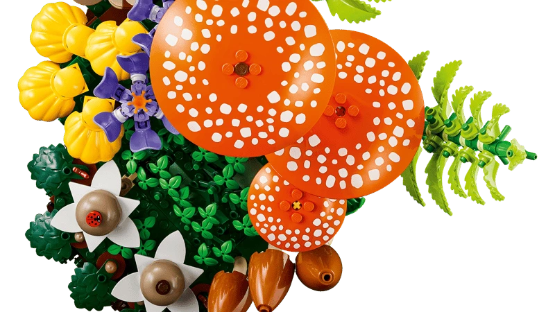 Top view of LEGO Woodland Mushrooms display with red mushrooms, purple crocuses and yellow flowers