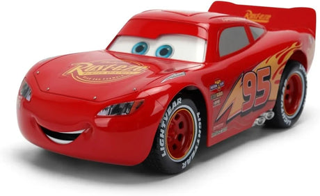 Disney Pixar Cars Lightning McQueen Animated RC viewed from the front and side, showing blue eyes, smiling mouth, red racing body, number 95 graphics and Rust-eze branding.