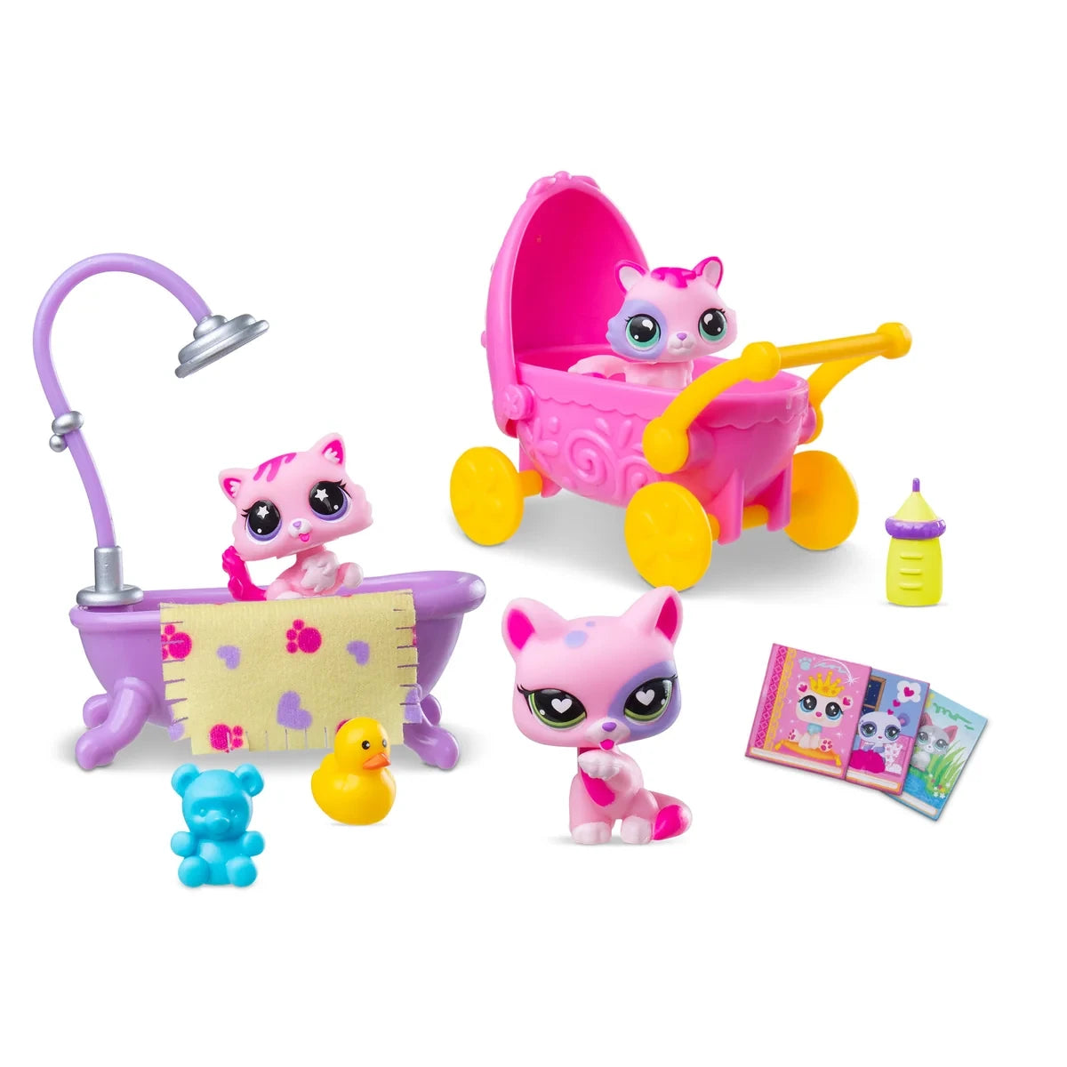 Three pink and white Littlest Pet Shop cat figures displayed with a purple bathtub and shower, pink baby pram, rubber duck, teddy bear, baby bottle and miniature books on a white background.