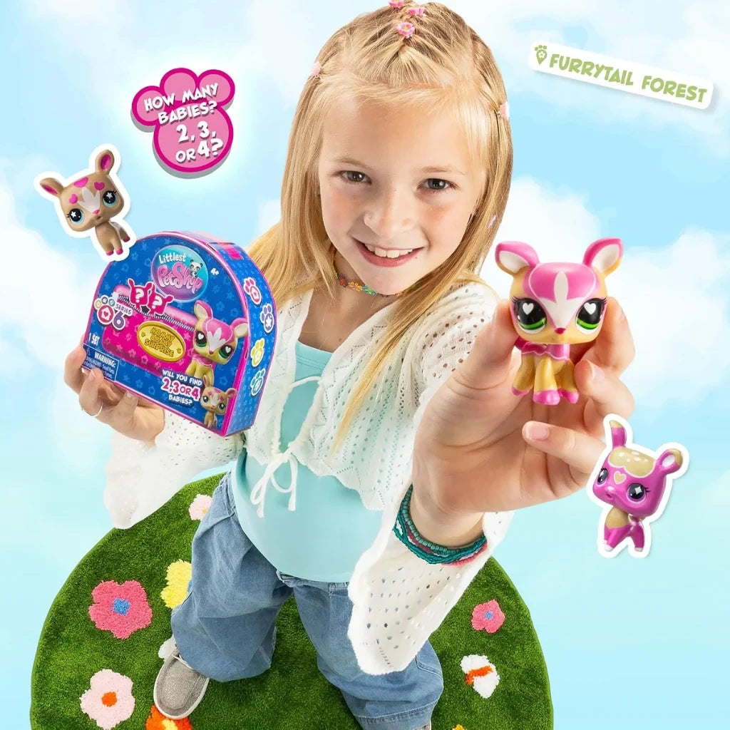 Young girl holding a Littlest Pet Shop deer mother figure and Mommy & Baby Series 6 surprise pack, with illustrated baby deer figures nearby.
