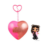 L.O.L. Surprise Music Festival Headliners Tots doll with long brown hair, oversized sunglasses resting on her head, a pink jacket, black crop top and black flared trousers, displayed beside a pink and rose gold heart capsule.