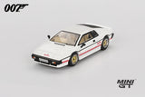 Mini GT Lotus Esprit Turbo white James Bond model viewed from the front left showing the wedge shaped nose, gold wheels and red lower body stripes