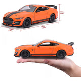 Maisto 2020 Ford Mustang Shelby GT500 showing model dimensions and side profile held in hand