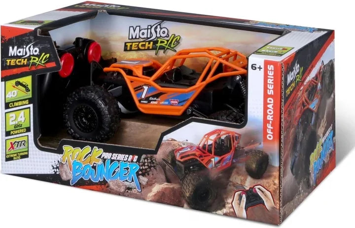 Orange Maisto Rock Bouncer remote control buggy displayed side view inside retail packaging with controller visible in Ireland