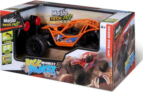 Orange Maisto Rock Bouncer remote control buggy displayed side view inside retail packaging with controller visible in Ireland