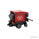 Rear right view of the BRIXIES Plus Massey Ferguson RB F round baler showing the rear chamber area, red housing and side wheel