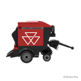 BRIXIES Plus Massey Ferguson RB F round baler in right side profile showing the red baler body, pickup section, drawbar and wheels