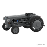 Front angled view of the BRIXIES Plus Massey Ferguson TEA 20 showing the grey bonnet, round headlights, exposed engine details and front wheel
