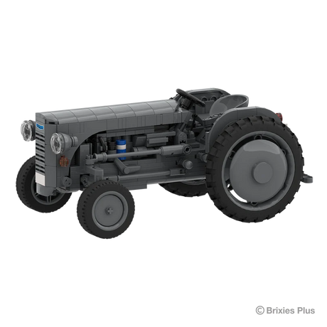 Front angled view of the BRIXIES Plus Massey Ferguson TEA 20 showing the grey bonnet, round headlights, exposed engine details and front wheel