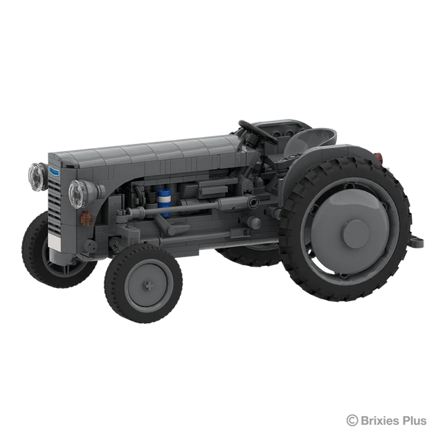 Front angled view of the BRIXIES Plus Massey Ferguson TEA 20 showing the grey bonnet, round headlights, exposed engine details and front wheel